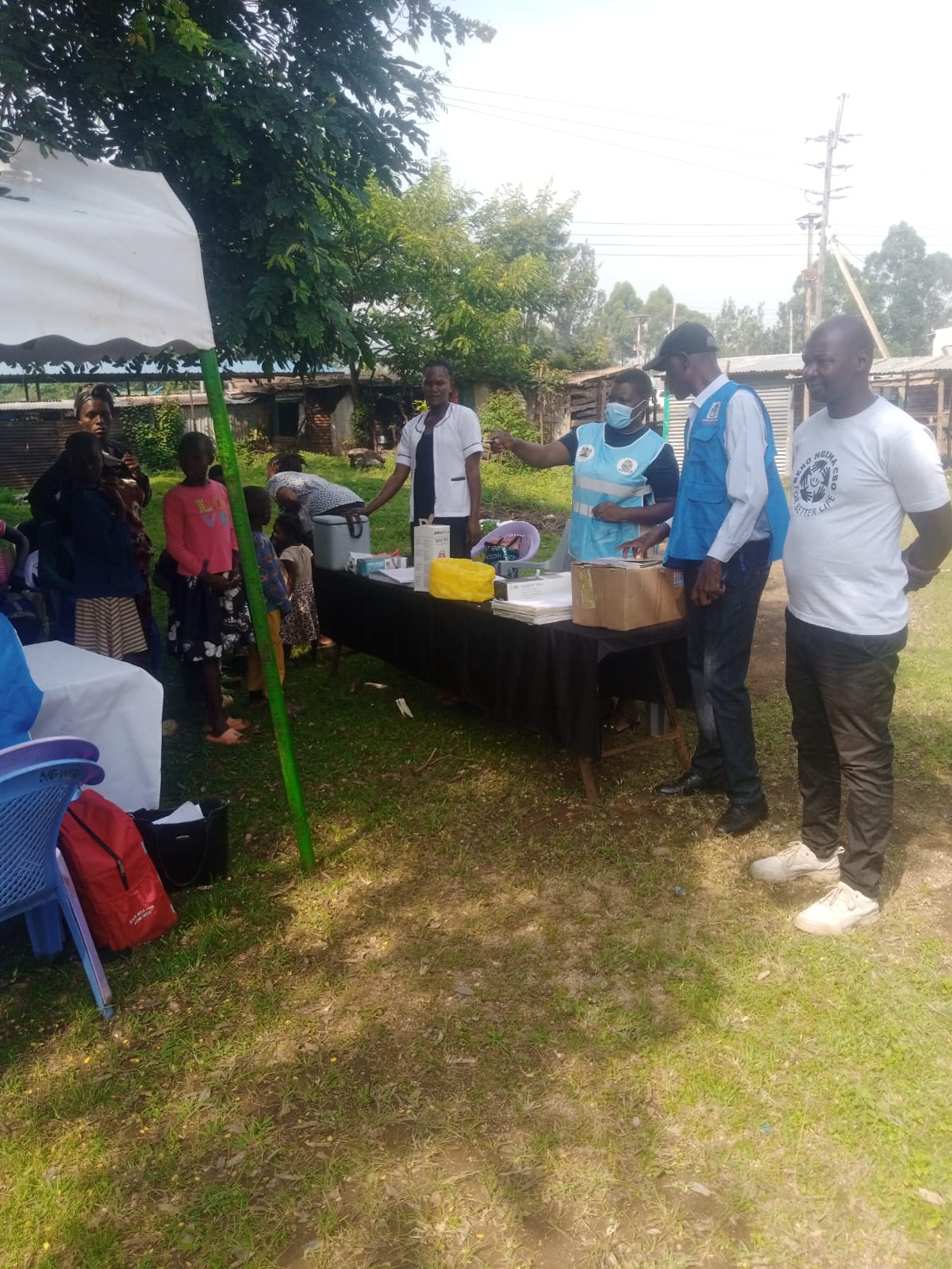 A doctor consulting with a patient during a free Bero Ngima medical camp